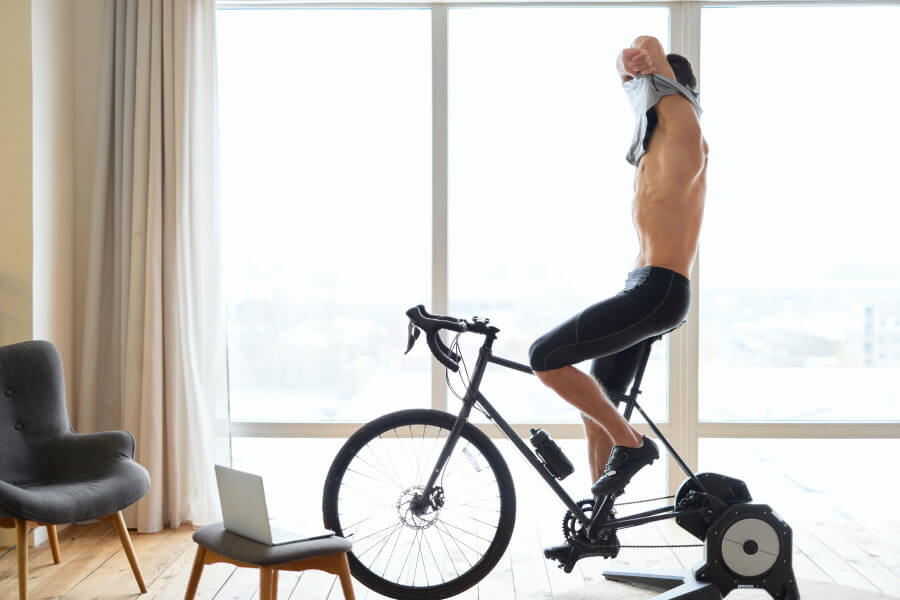 athletic-young-man-taking-off-shirt-while-cycling-2021-12-09-04-18-26-utc