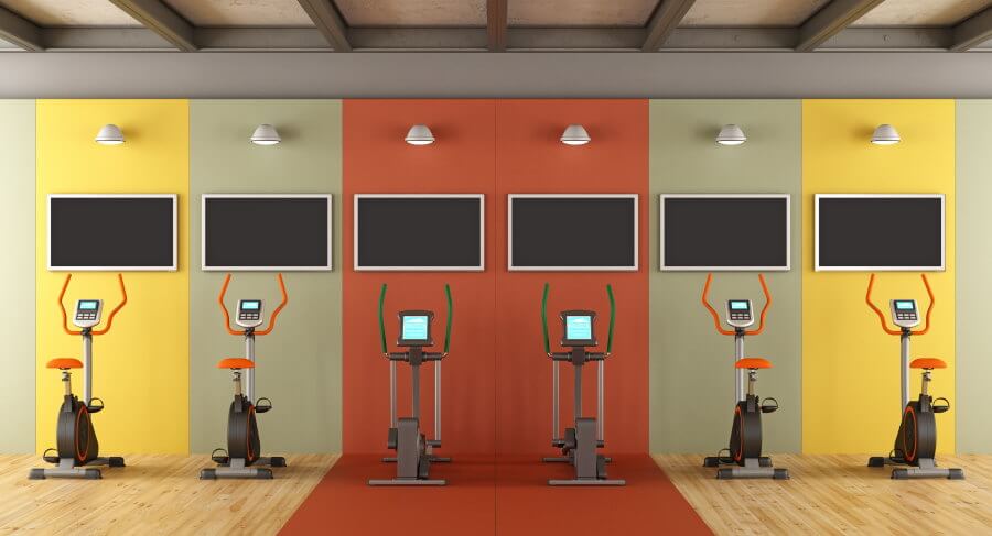 Colorful gym with stationary bikes and stepper bikes - 3d rendering